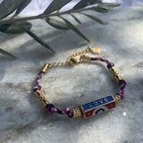 bracelet sur cordon fuschia marine, blanc et violet, perle cylindre en acier inoxydable dore multicolor